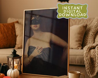 May include: A framed print of a woman in a black mask and strapless dress. The print is on a wooden table with a candle lantern, pumpkins, and the text "Instant Digital Download". Black bat decorations are on the wall.