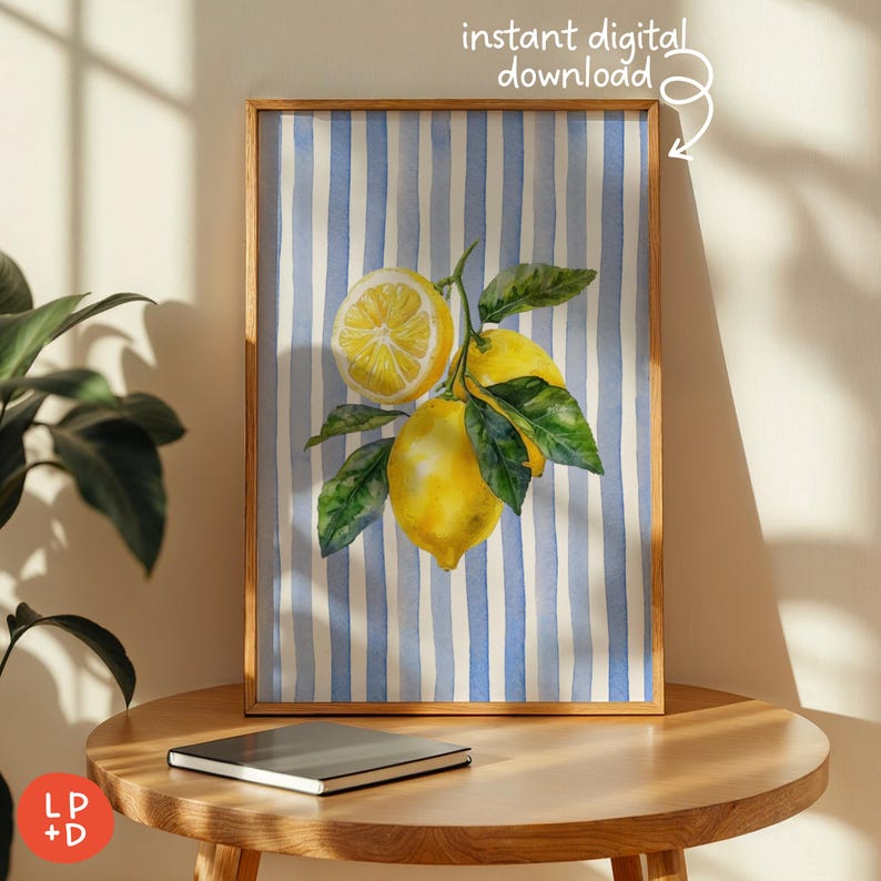 May include: A framed watercolor print featuring lemons on a branch with green leaves against a blue and white striped background. The print is in a wooden frame and has the text "instant digital download".