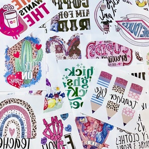 May include: A collection of colorful stickers with various designs and text. Designs include a cactus with a heart, a coffee cup, a rainbow, and pencils. Text includes "Teacher", "Sick", and "The Heart Wants What It Wants".