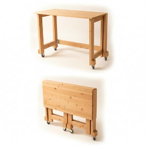 May include: A light-colored wooden folding table with a rectangular top and four legs. The table is on wheels for easy movement. The table is shown both fully extended and folded.