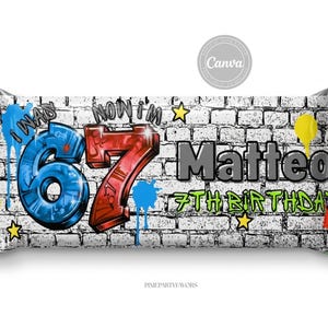 May include: A candy bar wrapper with a graffiti-style design. The wrapper features a brick wall background with colorful paint splatters. The text includes "I WAS 6" and "NOW I'M 7", the name "Matteo", and "7TH BIRTHDAY".