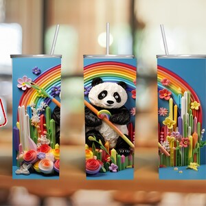 May include: A sublimation design featuring a panda bear holding a paintbrush in front of a rainbow and colorful flowers. The design is perfect for a 20 oz skinny tumbler.