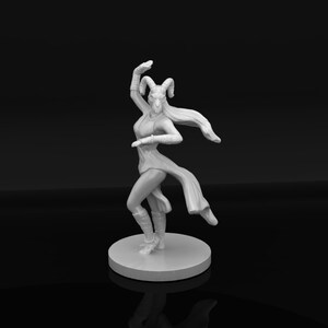 May include: A white unpainted miniature figurine of a humanoid creature with curved ram horns, long flowing hair, and a dynamic dancing pose. The figure wears a tunic with a high-low hemline, arm wraps, and leg wraps, standing on a circular base.