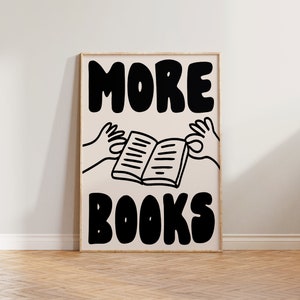 Peut inclure: Une affiche en noir et blanc avec le texte "MORE BOOKS" en lettres grasses et en blocs. Deux mains tiennent un livre ouvert au milieu de l'affiche.