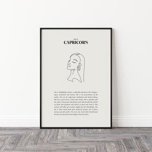 May include: Black and white line art print of a woman's face with the text "Capricorn" and a description of the astrological sign. The print is framed in a black frame.