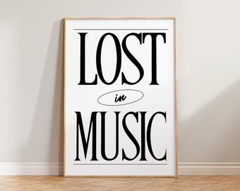 May include: A black and white framed poster with the text "LOST in MUSIC" in a bold, serif font.