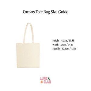 May include: A beige canvas tote bag with a 42 cm / 16.5 in height, 38 cm / 15 in width, and 32.5 cm / 13 in handle. The bag is on a white background with the text "Canvas Tote Bag Size Guide" and "LUNEC *CLUB" in pink and green.
