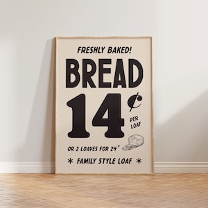 May include: A vintage-style sign advertising freshly baked bread for 14 pence per loaf or 2 loaves for 24 pence. The sign features a black and white illustration of a loaf of bread and the text "FAMILY STYLE LOAF".