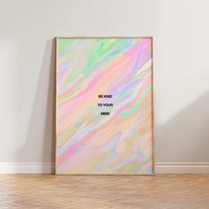 May include: A framed art print with a pastel abstract design in shades of pink, green, and blue. The text "BE KIND TO YOUR MIND" is printed in black. The frame is a light wood color.