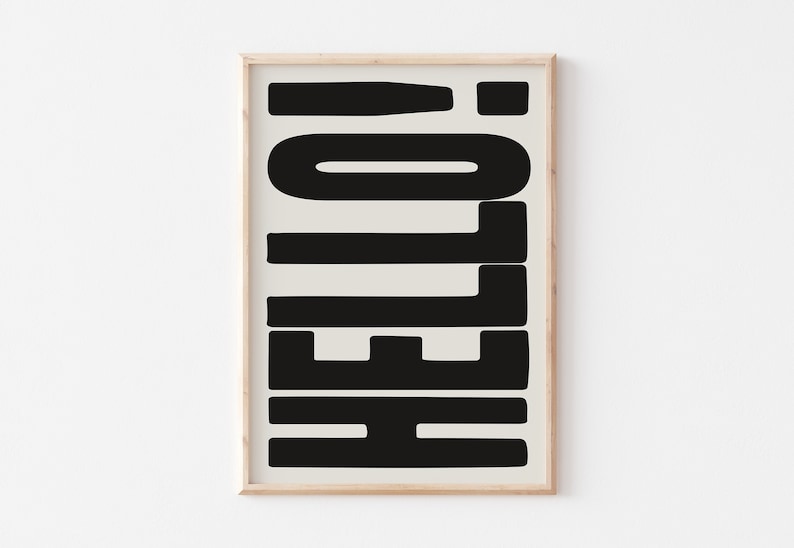 May include: A framed print with the word "HELLO" in black block letters on a beige background.
