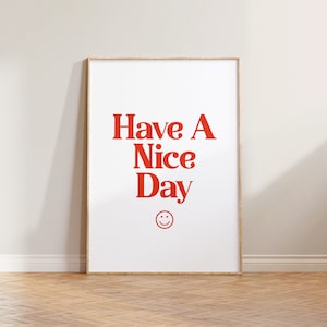 May include: A framed print with the text "Have A Nice Day" in red letters and a red smiley face below the text.