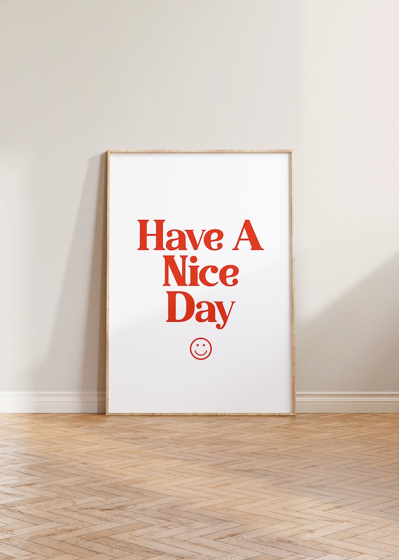 May include: A framed print with the text "Have A Nice Day" in red letters and a red smiley face below the text.