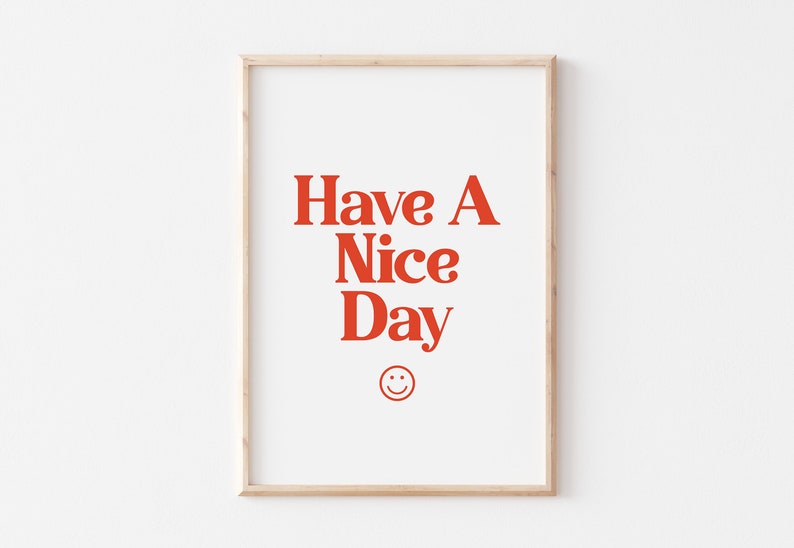 May include: A framed print with the text "Have A Nice Day" in red letters and a red smiley face below the text.