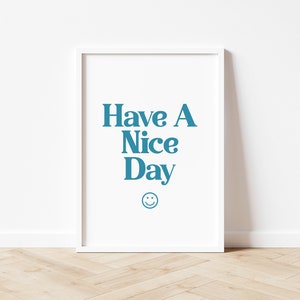 May include: White framed poster with the text "Have A Nice Day" in blue lettering and a blue smiley face.