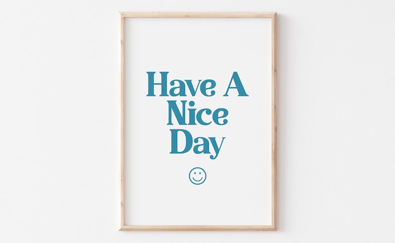 May include: A framed print with the text "Have A Nice Day" in blue lettering and a smiley face below the text.