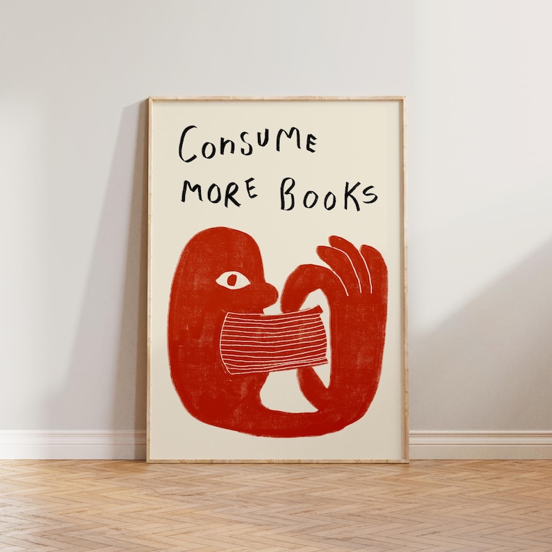 May include: A red illustration of a person consuming a book with the text "CONSUME MORE BOOKS" above the illustration.
