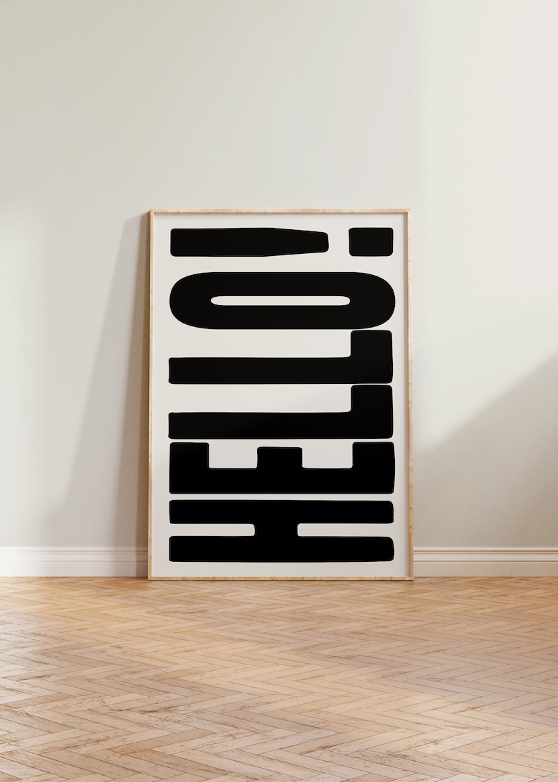 May include: A framed black and white print with the word "HELLO" in bold, block letters.
