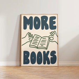 Peut inclure: Une affiche avec un fond beige clair et un cadre bleu fonc&eacute;. L'affiche pr&eacute;sente le texte "MORE BOOKS" dans une police audacieuse et ludique. Le texte est en bleu fonc&eacute;. Un dessin au trait vert de deux mains tenant un livre ouvert se trouve au centre de l'affiche.