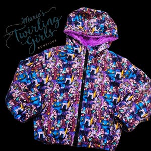 May include: A hooded jacket with a colorful pattern featuring cartoon characters. The jacket has a black zipper and a purple faux fur lining in the hood. The jacket is from Marie's Twirling Girls Boutique.