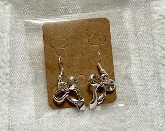 Adorable silver dangling bow earrings