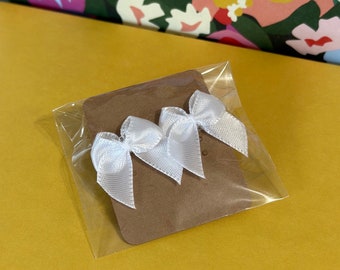 mini white bow earrings