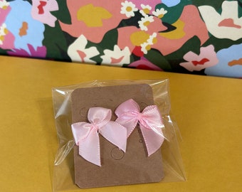 Mini pink bow earrings