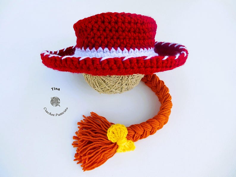 May include: A handmade crochet hat in red with a white trim, a braided orange yarn, and a yellow accent. The hat is designed to resemble a cowboy hat. The image includes the text "Tina Crochet Patterns".