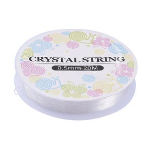 May include: A spool of clear elastic string labelled "CRYSTAL STRING 0.5mm 20M" with a colourful design of swirls and butterflies.