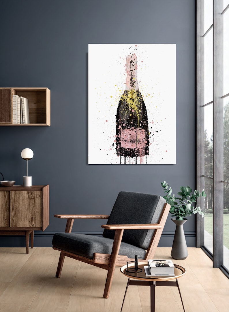 May include: A pink champagne bottle with gold accents, painted in a watercolour style with splatters of paint.