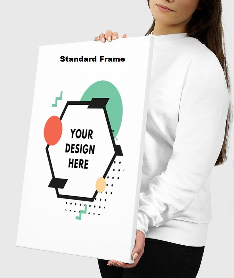 May include: A white canvas with a geometric design featuring a hexagon with the text "YOUR DESIGN HERE" inside. The hexagon is surrounded by a green circle, a red circle, and a yellow circle with black polka dots. The text "Standard Frame" is at the top of the canvas.