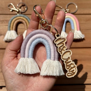 May include: A pastel rainbow keychain with white tassels and a wooden tag that says "Mrs. Cristy".