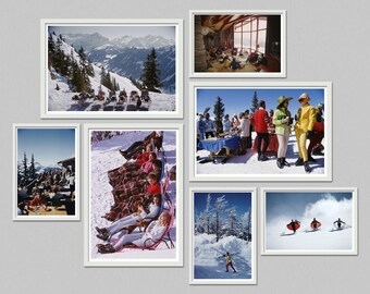 May include: A collection of framed vintage photographs depicting scenes of people enjoying winter activities. The images show skiers, people relaxing in the snow, and gatherings in a snowy mountain setting. The frames are white, and the overall aesthetic is retro.