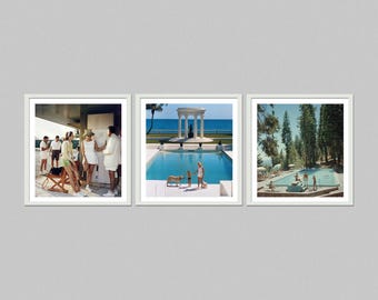 May include: A set of three framed prints. The first shows a group of people near a building. The second shows a pool with a structure in the background. The third shows a pool surrounded by trees.