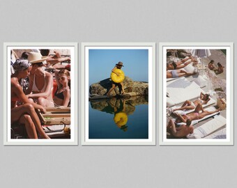 May include: A triptych of framed photographs depicting scenes of leisure. One shows people sunbathing, another features a person carrying a yellow object near water, and the third shows people relaxing and playing games.