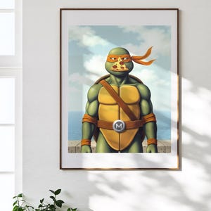 May include: Framed artwork depicting a Teenage Mutant Ninja Turtle character with an orange mask and a pizza slice on its face. The turtle wears a brown belt with a silver buckle. The background shows a blue sky and sea.