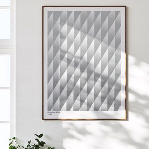 May include: A framed print featuring a geometric pattern of alternating light and dark gray diamond shapes. The artwork is labeled "LIVERPOOL 89/90 AWAY" in small, white text at the bottom. The frame is a dark brown color.