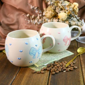 Cute Handmade Mug – Unique Ceramic Coffee Cup with Bow & Raised Heart Details, Perfect Pottery Gift for Birthdays, Christmas and Home Decor