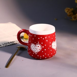 Eco-friendly red mug perfect for coffee or tea.