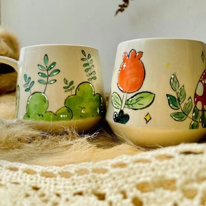 Unique handmade ceramic mug with nature-themed designs