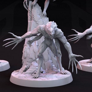 May include: Six grey painted miniature figures of humanoid creatures with sharp claws and a reptilian appearance. The figures are posed in various dynamic stances, with some standing on rocky bases.