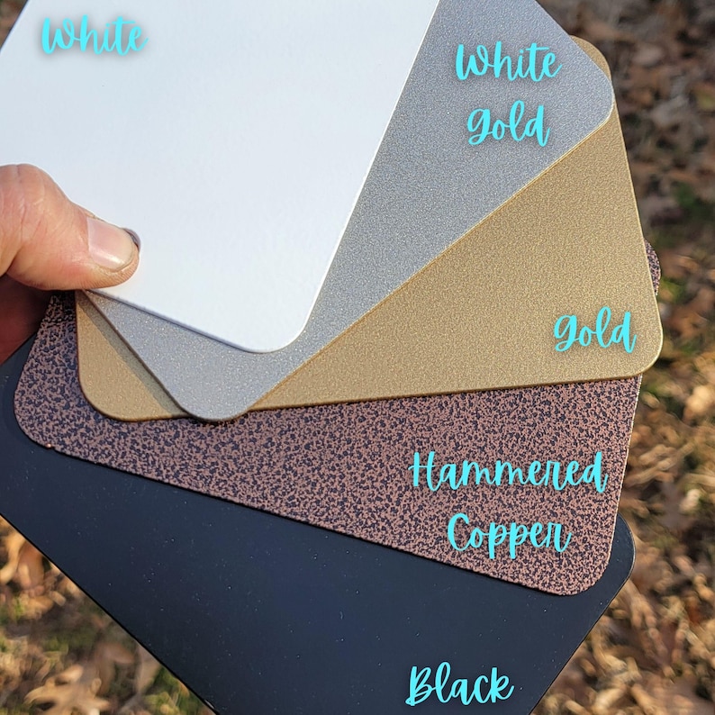 Powder coated color options for handmade metal kids art display boards, including white, white gold, gold, hammered copper, and black. Ideal for customizing your kids magnet board, art display board, or artwork display sign. Choose a finish to match your playroom decor, kids room decor, or classroom space. Each kids artwork display is made in the USA and perfect for showcasing drawings, crafts, and creations with a personalized touch.