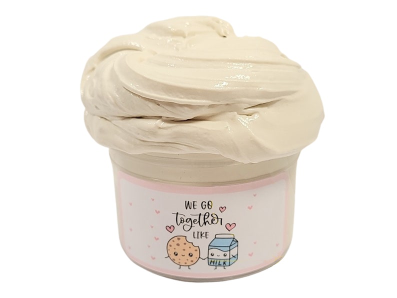 May include: A white slime in a clear jar with a pink and white label that says "We go together like" with a cartoon cookie and milk carton holding hands.