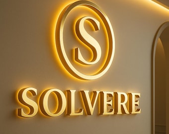 May include: A gold-colored illuminated sign with the letter "S" inside a circle, and the word "SOLVERE" below it. The sign is mounted on a beige wall, with a warm, inviting glow.