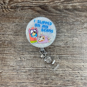 Two Inch Round Bluey Inspired Badge Reel; Slipped on my beans; Interchangeable Option; Acrylic Beaded; Glittered; Heeler; Grannies