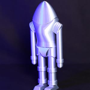 May include: A silver robot toy with a rounded head and segmented limbs. The robot is standing on a black surface.