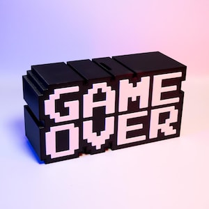 Game Over Piggy Bank Fun Gaming-Themed Savings Bank Unique Desk Decor Perfect Gift for Gamers Retro Arcade Style Coin Bank