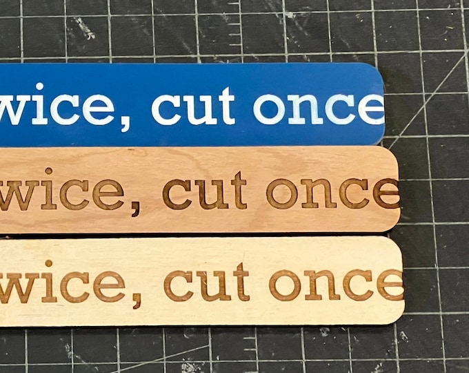 Measure twice, cut once sign