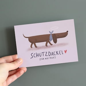 Postkarte Schutzdackel I Karte Grusskarte Schutzengel Dackel Dackelfan Mutmacher Glücksbringer Geschenk Freundin Freund Lustig