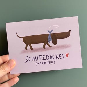 Postkarte Schutzdackel I Karte Grusskarte Schutzengel Dackel Dackelfan Mutmacher Glücksbringer Geschenk Freundin Freund Lustig
