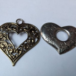 2 Vintage costume silver & gold heart shaped pendants